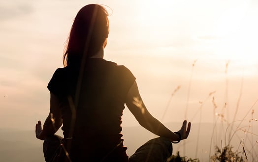 women meditating in the nature